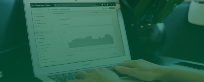 Person typing on a MacBook Air displaying platform analytics, analyzing website performance and 404 errors.